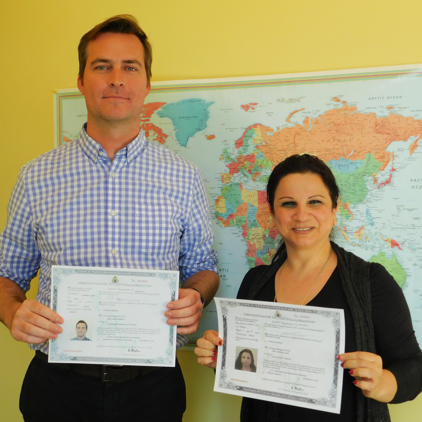 USW Fiscal Officer Kurt Coppens and Administrative Assistant Nada Obaid hold their certificates proclaiming them citizens of the United States of America, December 2018.
