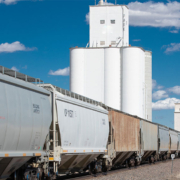 Image shows grain rail cars by a country elevator to illustrate USW comments to the Surface Transportation Board.