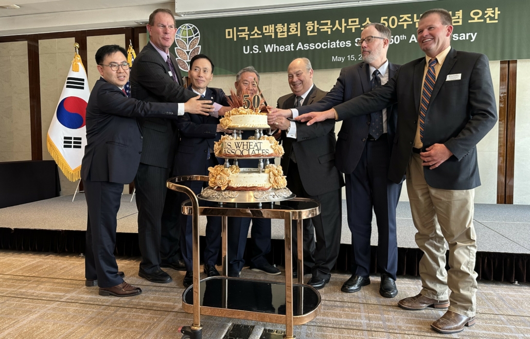 Executives from the South Korean flour milling and baking industries, USDA FAS, and USW cut a ceremonial cake celebrating the 50th anniversary of USW's Seoul office.