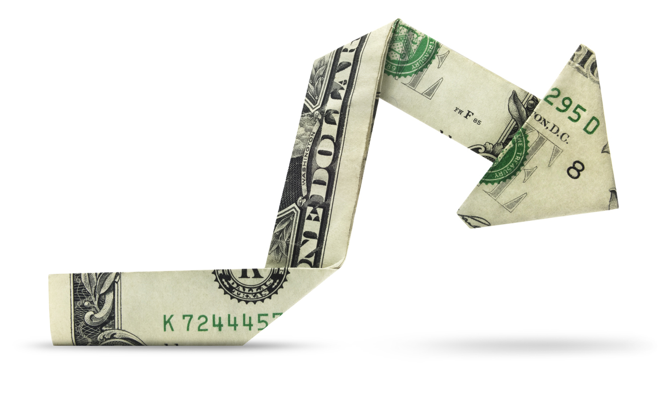 Image shows a folded US$ bill shaped like a price movement chart up and down and flat.