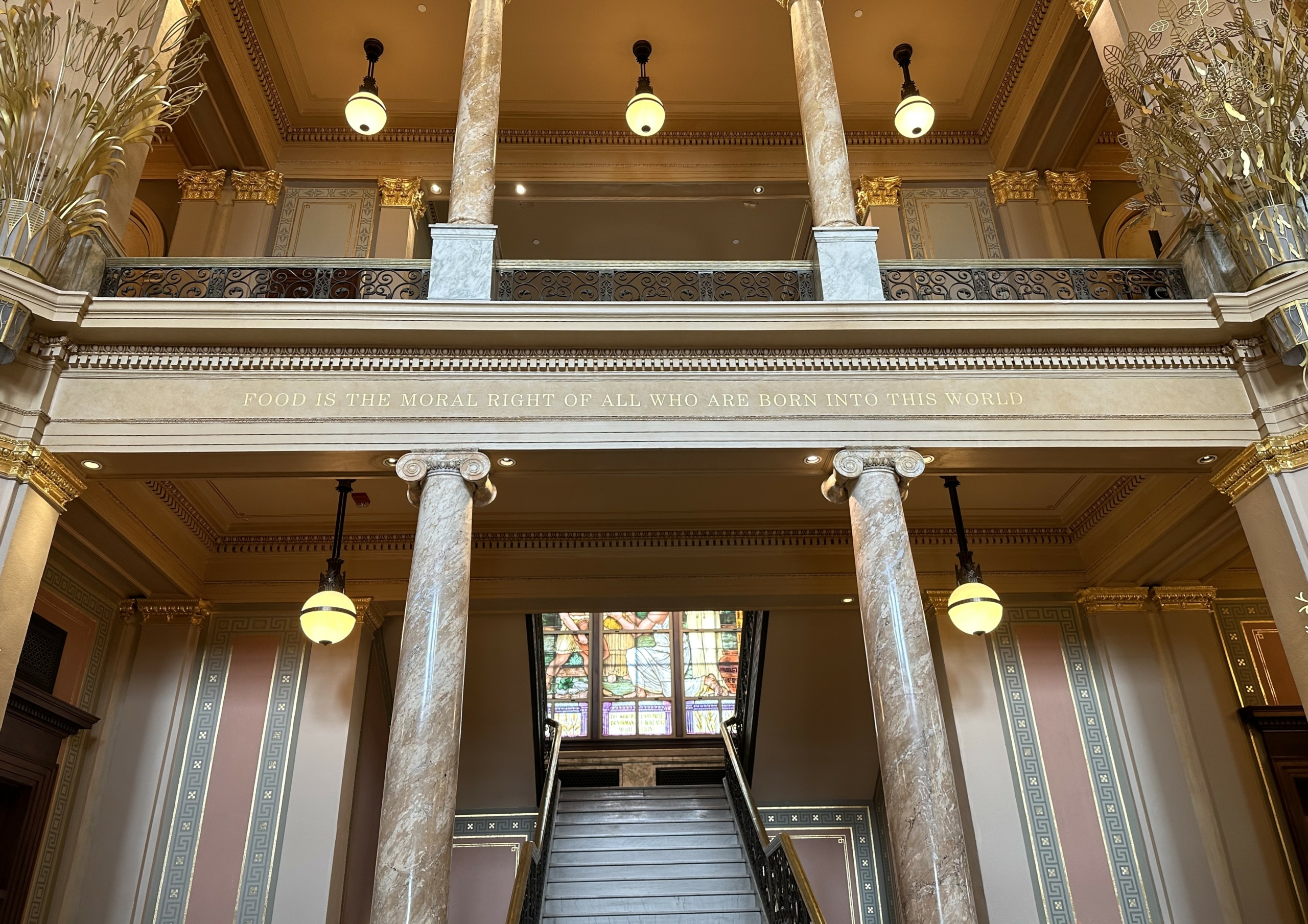 This image shows the entrance of the World Food Prize Hall of Laureates and a quote by the late Dr. Norman Borlaug.