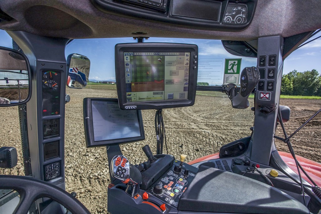 Interior of an agricultural vehicle with precision agriculture technology.