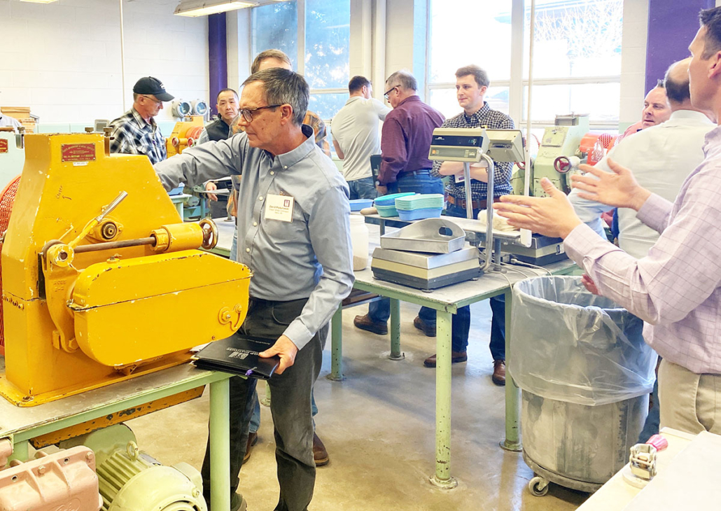 Photo shows the flour milling classroom at Kansas State University (KSU) Shellenberger Hall with industry students test milling flour.