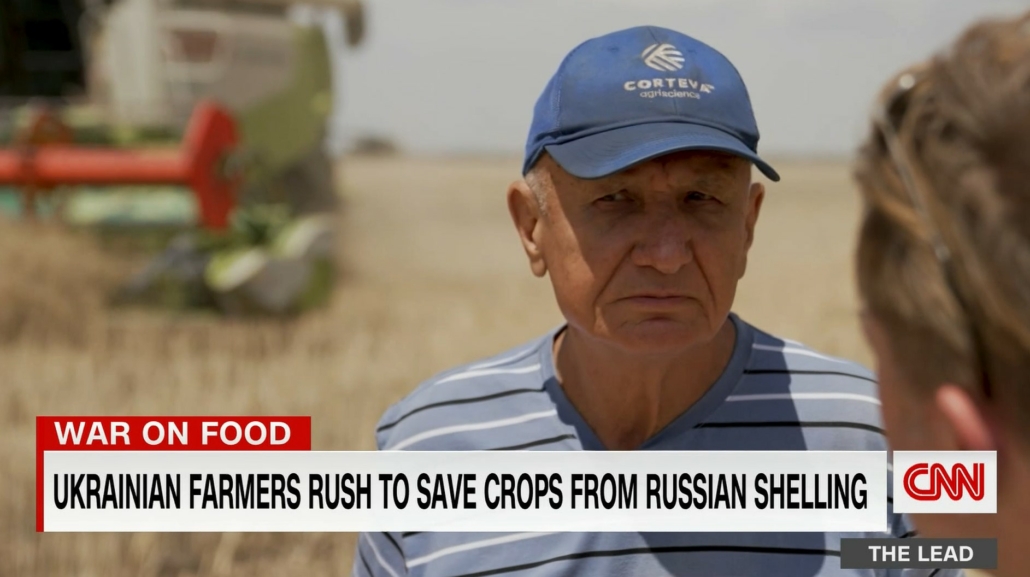 A Ukrainian wheat farmer talks to CNN reporter Ivan Watson