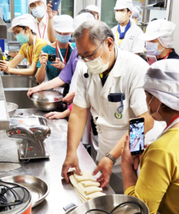 A professional chef demonstrates methods for using U.S. wheat to make handmade noodles during a Wheat Food workshop for volunteers in Taipei’s adult long-term care community. The October 2022 workshop was part of USW's ongoing effort to develop new wheat food options for Taiwan's aging populations.