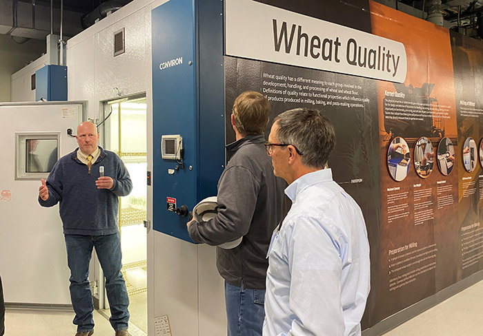Kansas Wheat CEO Justin Gilpin, far left, leads a tour of the Kansas Wheat Innovation Center.
