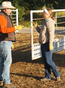 Tom cannon and his daughter Raegan trade ideas as they get ready to work cattle.